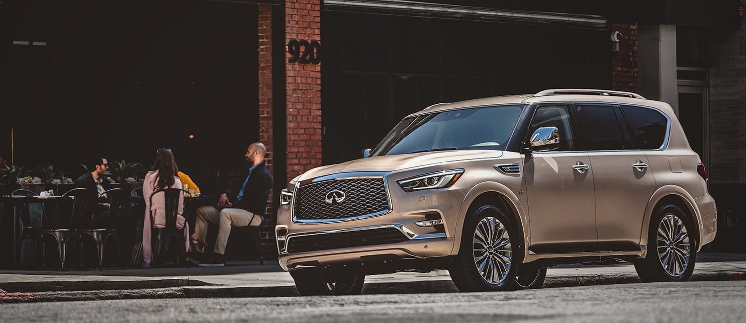 INFINITI on a city street outside a cafe